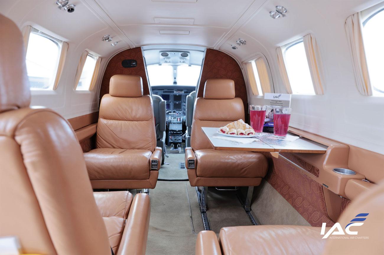 Fly with IAC. Image of the Conquest C441 Cessna aircraft interior of International Air charters.