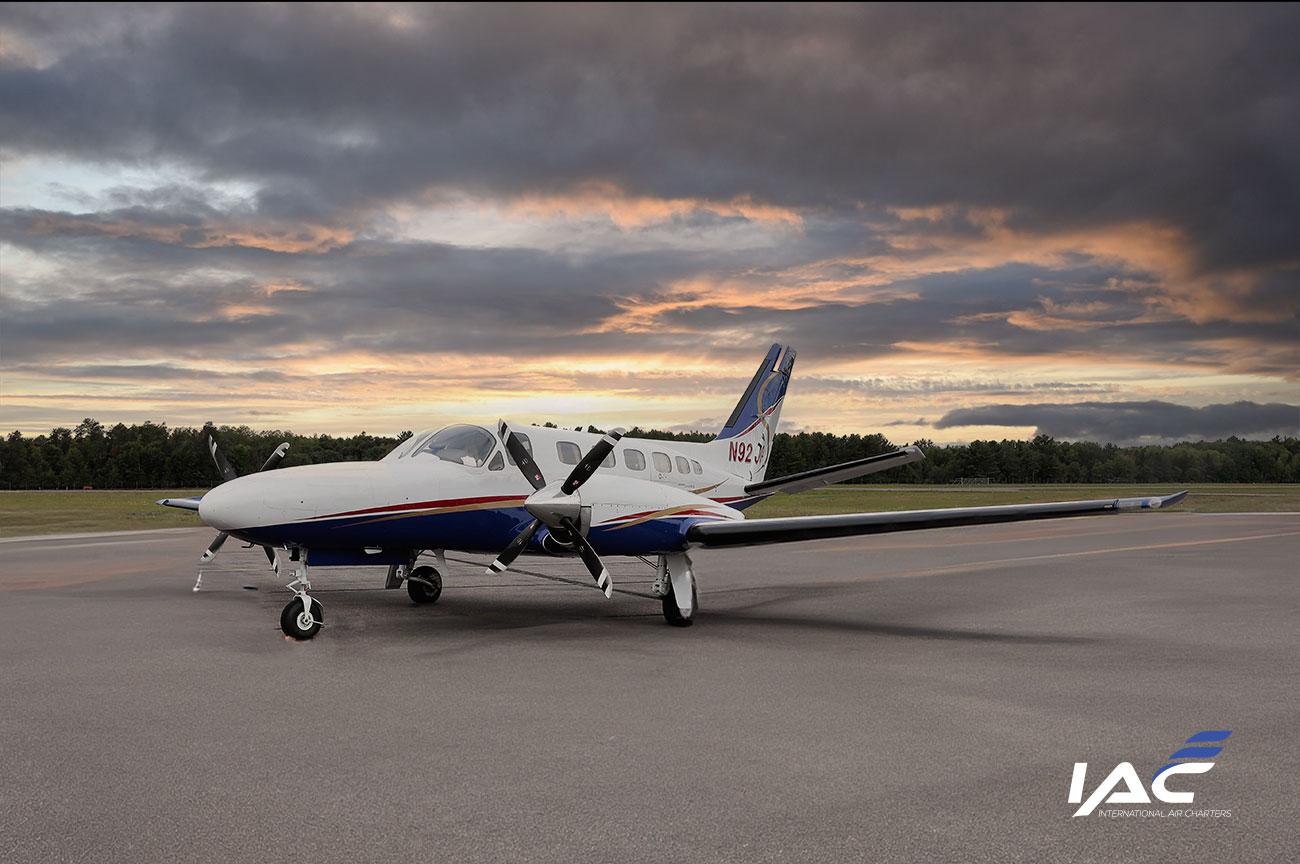 Fly with IAC. Image of the Conquest C441 Cessna aircraft exterior evening of International Air charters.